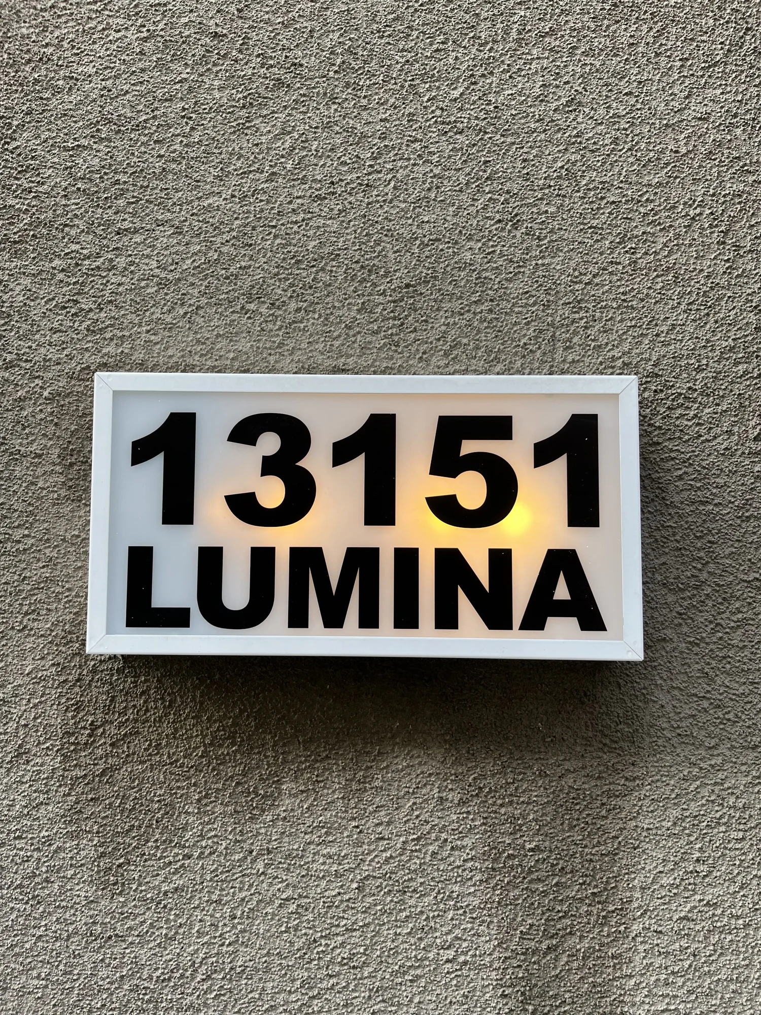 Backlit illuminated 13151 Lumina address sign mounted on stucco wall — Print the Chicken custom address signage