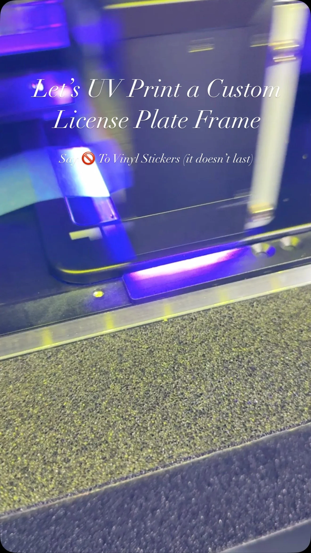 License plate frame on UV printer bed mid-cure with neon purple UV LEDs